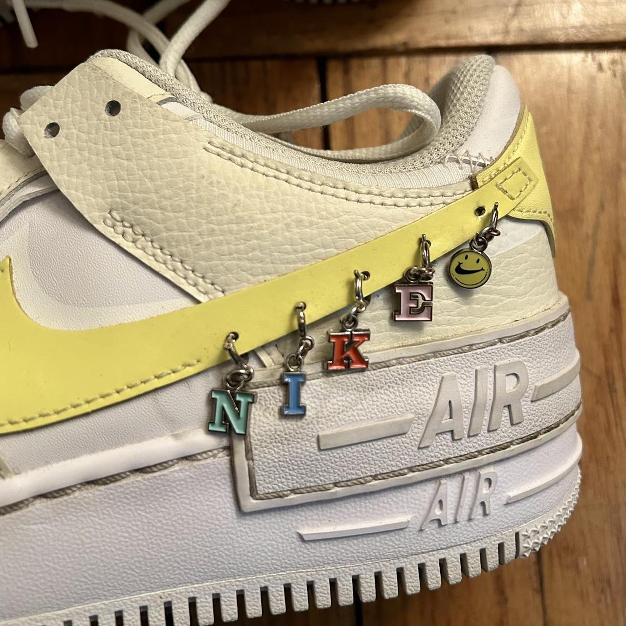yellow air max with charms
