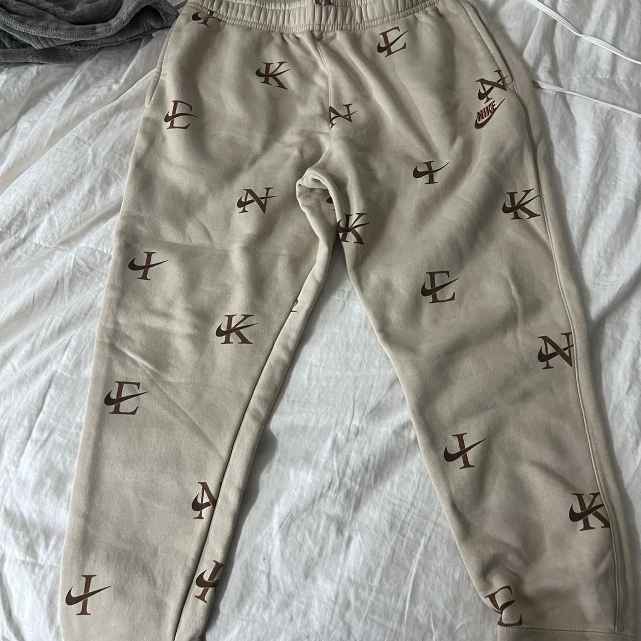 tan nike letter joggers, never worn, easy to style