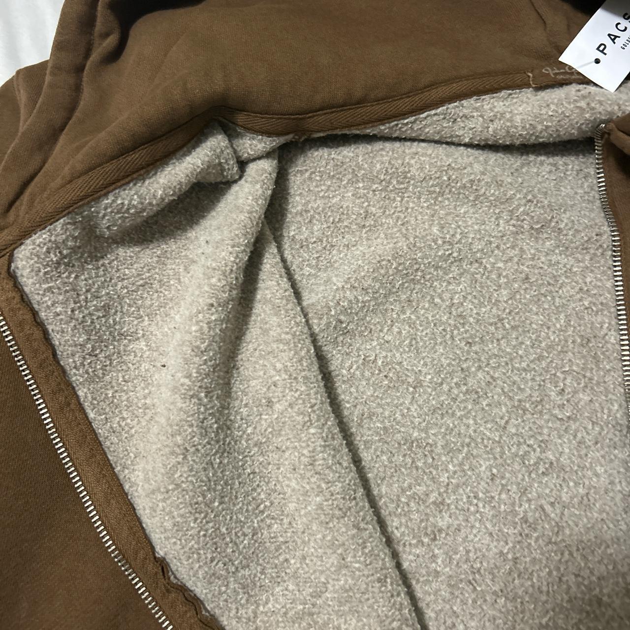 Oversized brown zip up, never worn - Depop