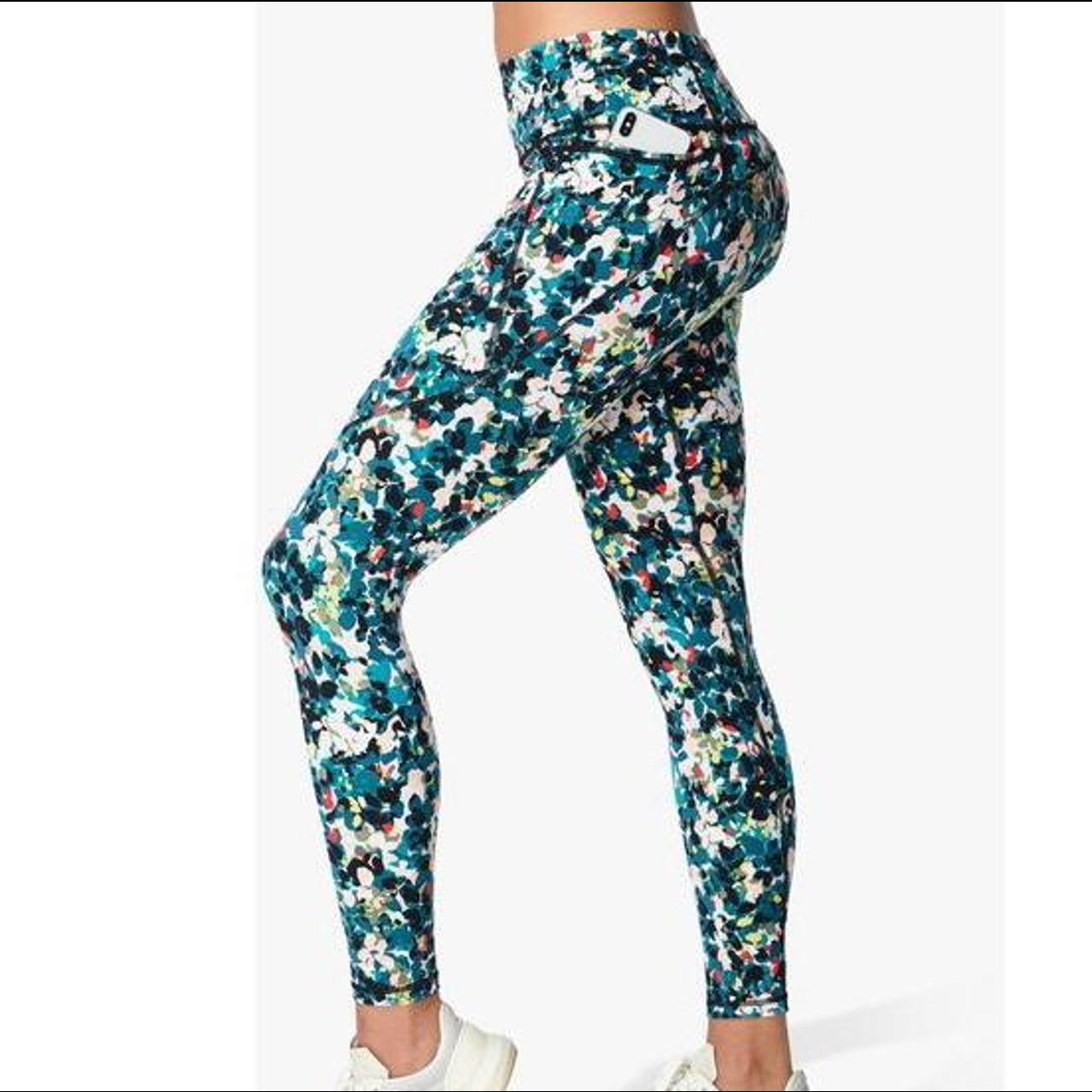 Sweaty Betty leggings in “Blue Floral Splash Print”.