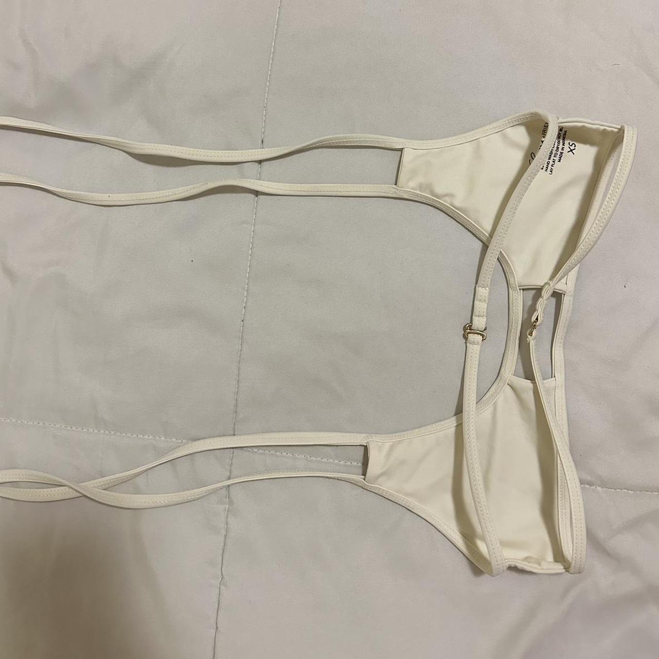 White bikini top. Super cute open back. Looks crème... - Depop