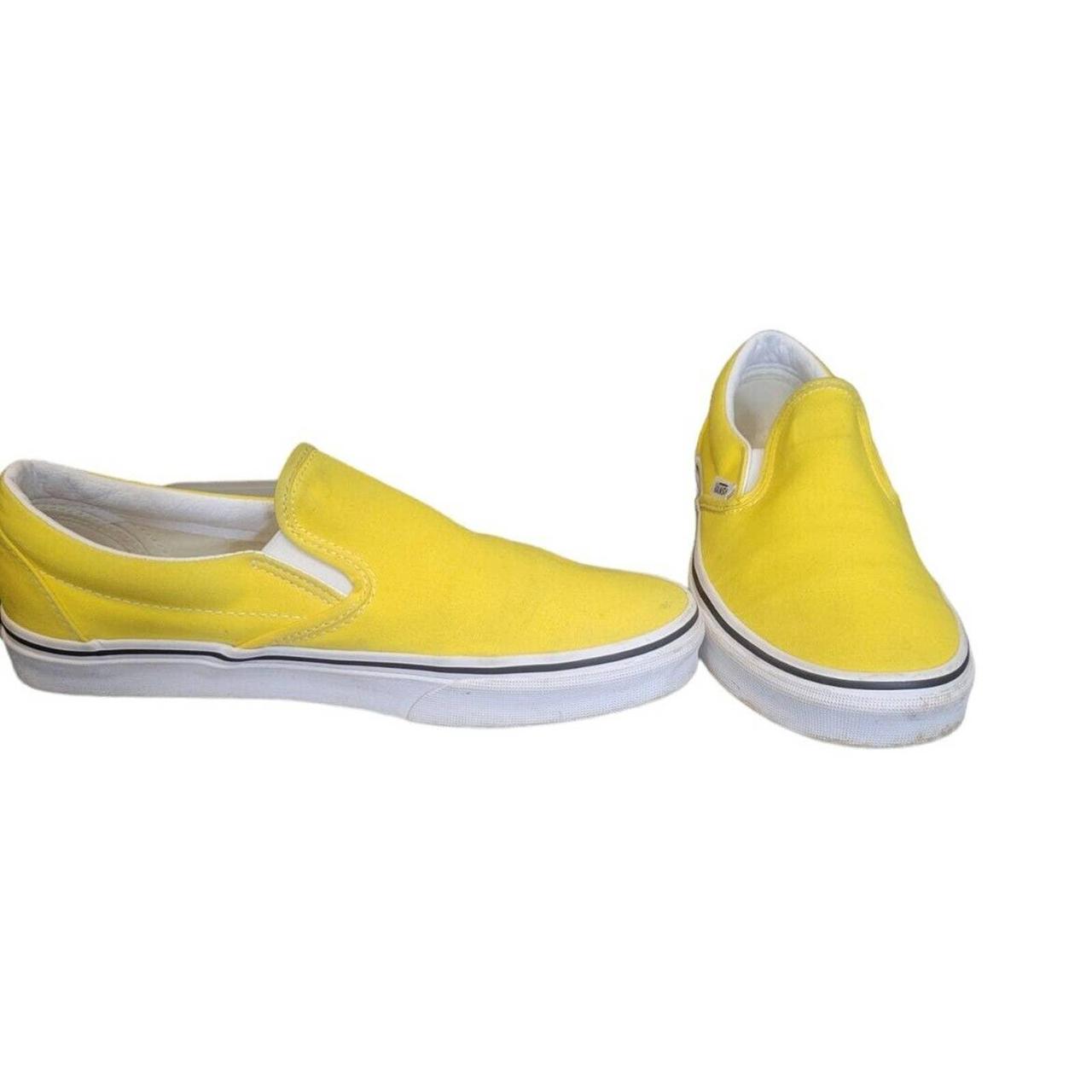 Vibrant yellow shop slip on vans