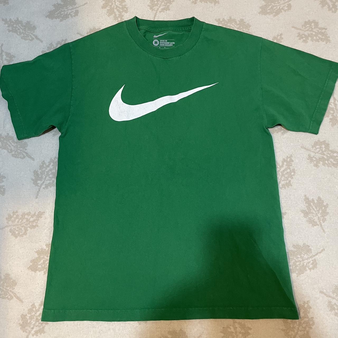 green and gray nike shirt