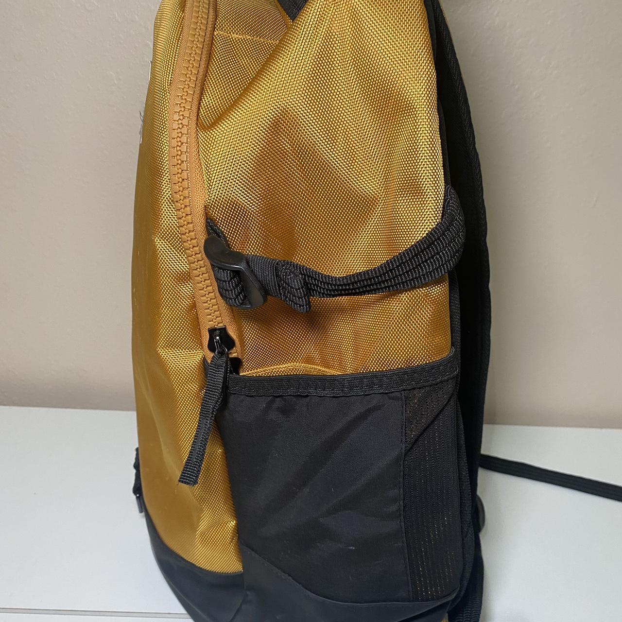 yellow and black nike backpack