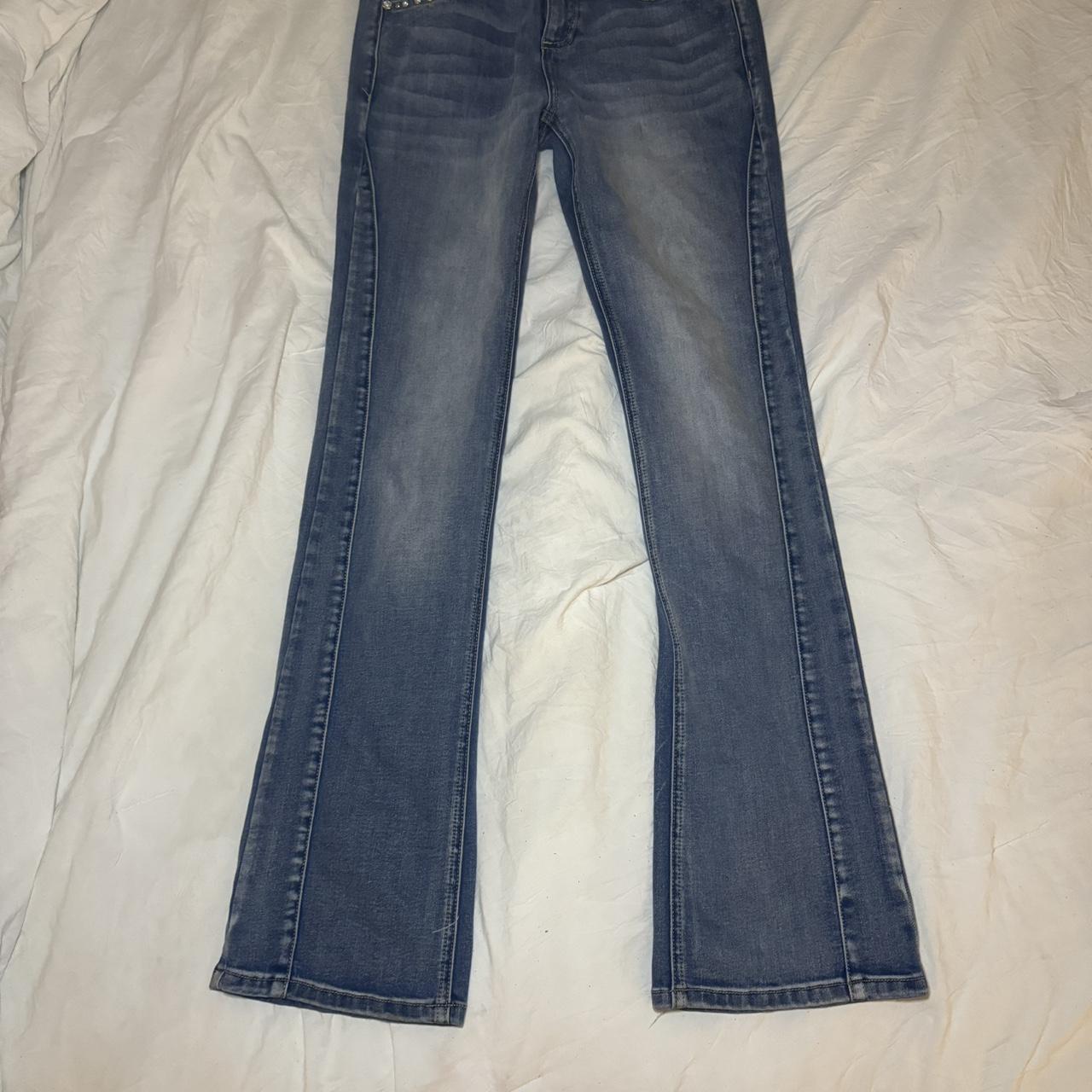 sick bedazzled cross mid rise flared jeans. so cute... - Depop