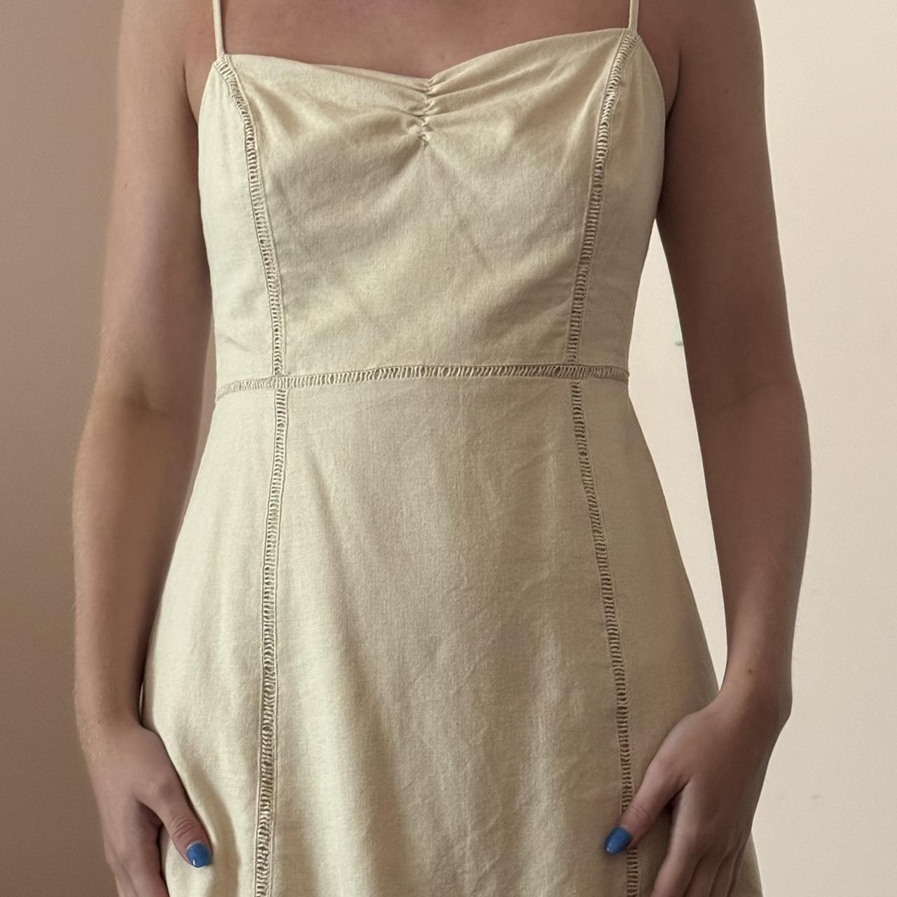 Beige/tan linen dress. Fits super well and barely - Depop