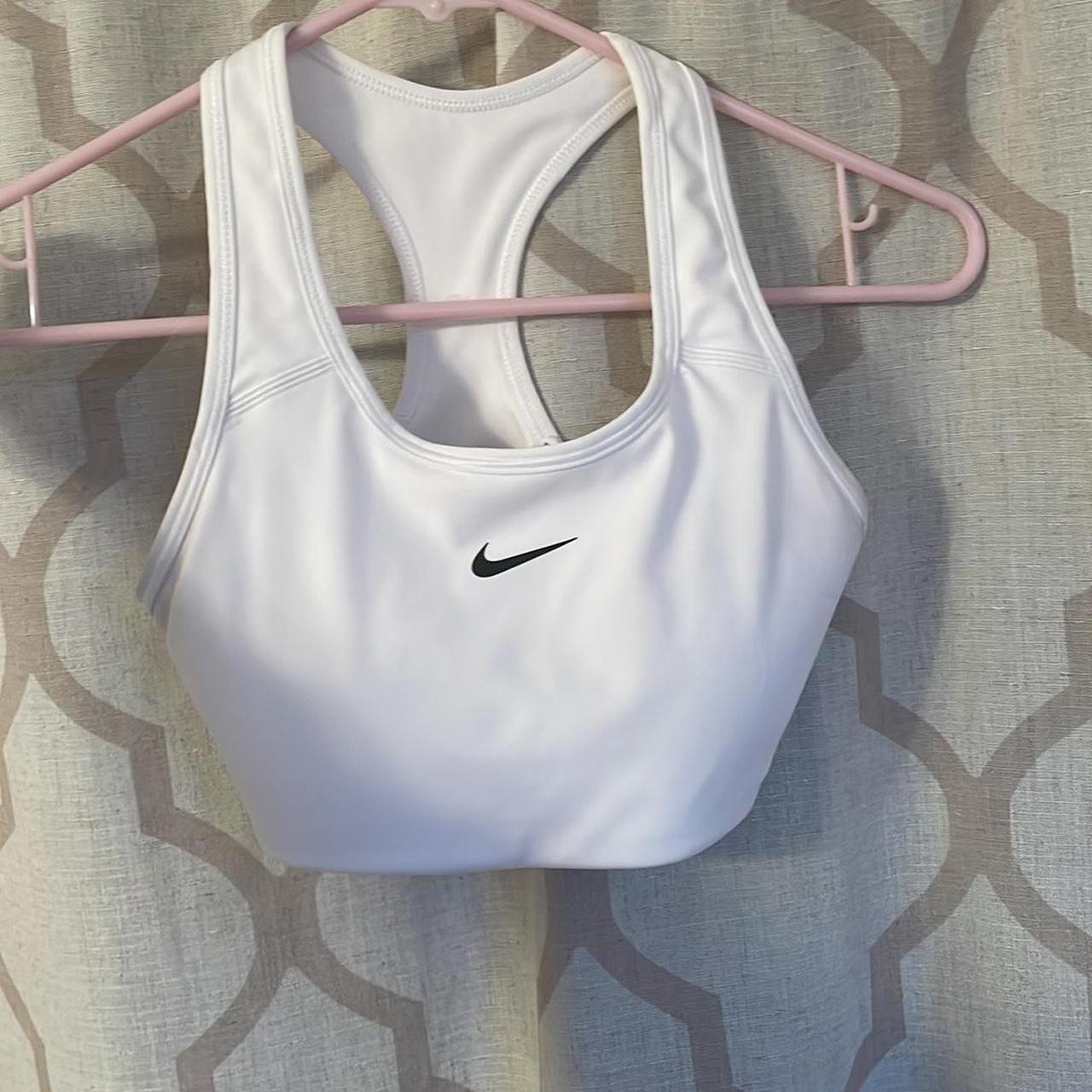 Nike sports bra. Black. Neon tick. Worn once still - Depop