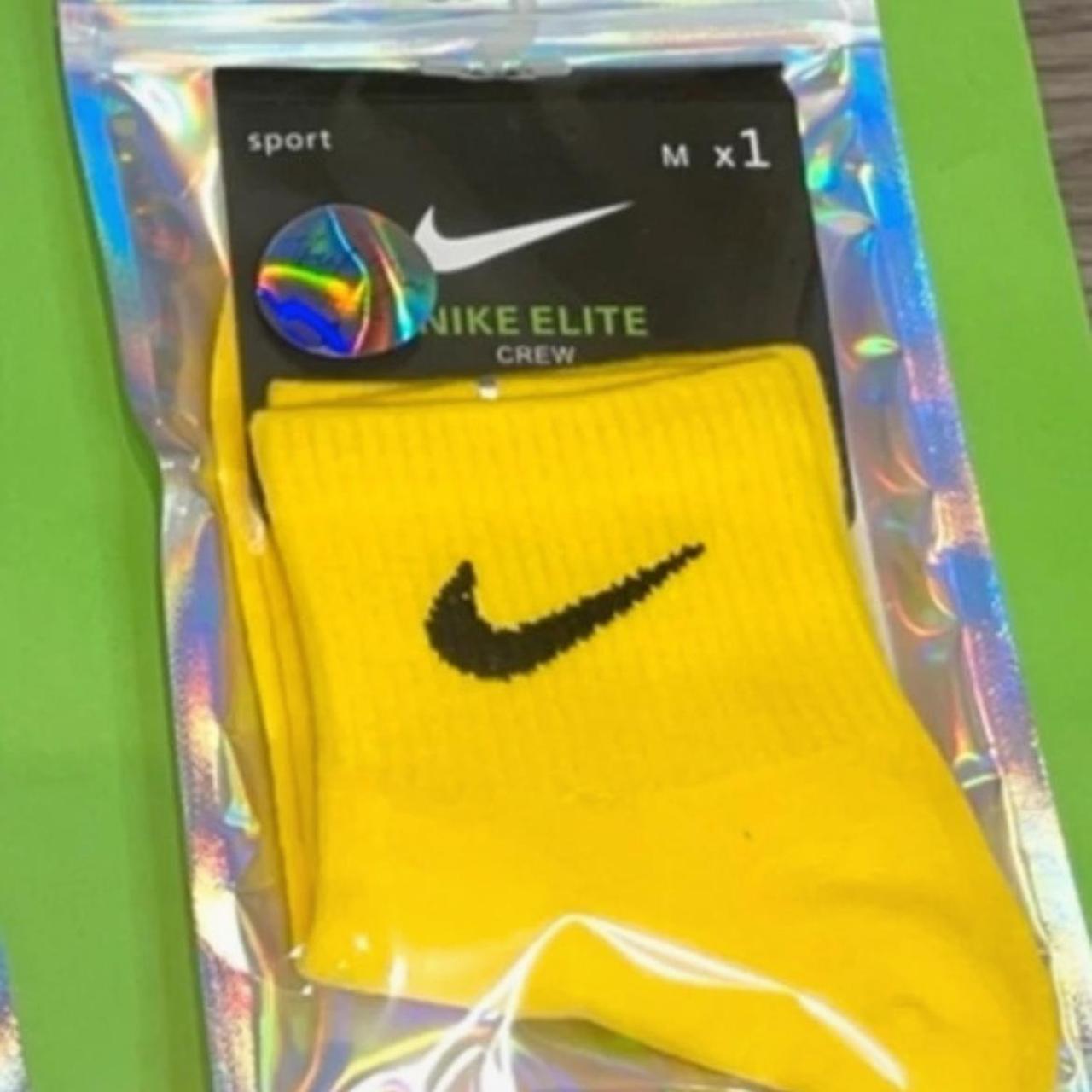 white nike yellow tick