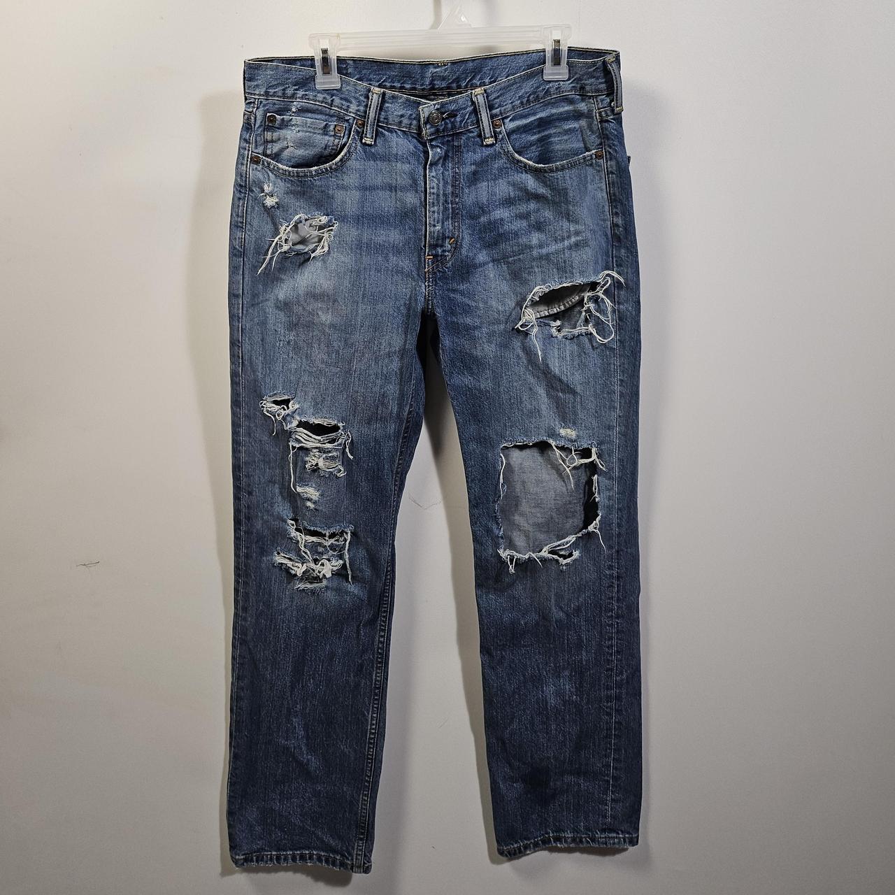 Levi 514 ripped jeans hotsell