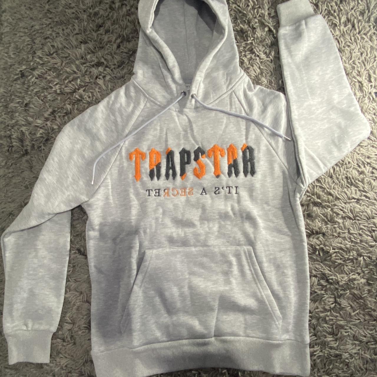 Orange hoodie with black on sale writing