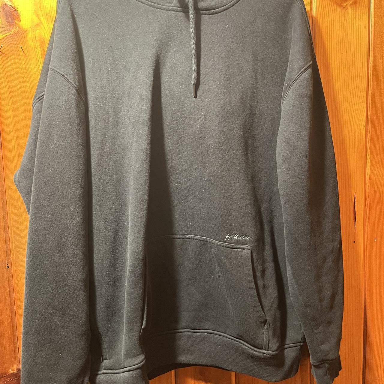 Plain black hollister hoodie has a zipper on the... - Depop