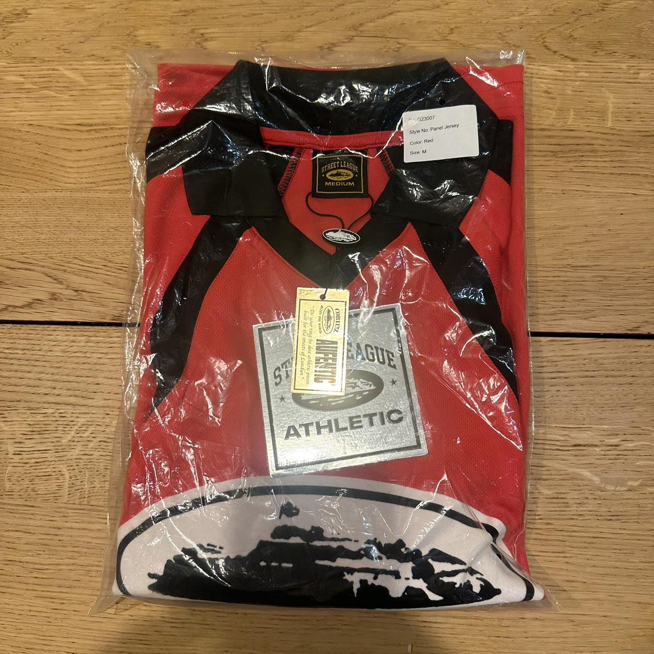 Red and black corteiz football shirt. Size M Message... - Depop