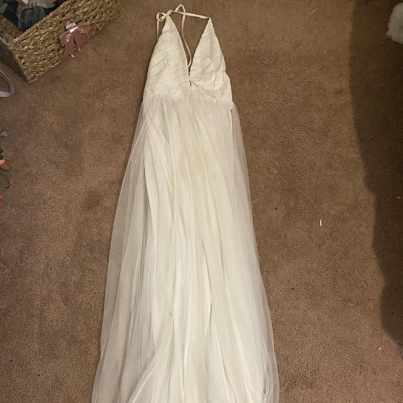 A white wedding dress with a sequin top which is Depop