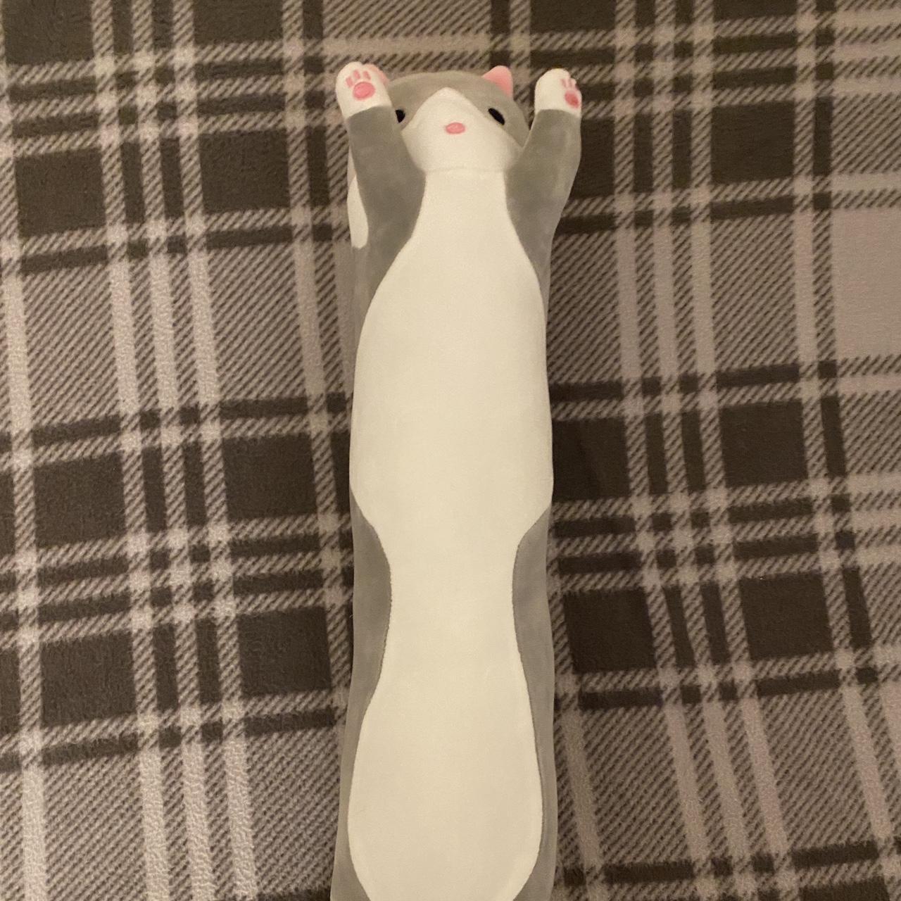 A long grey cat plush. About 15 inches long and 2.5... - Depop