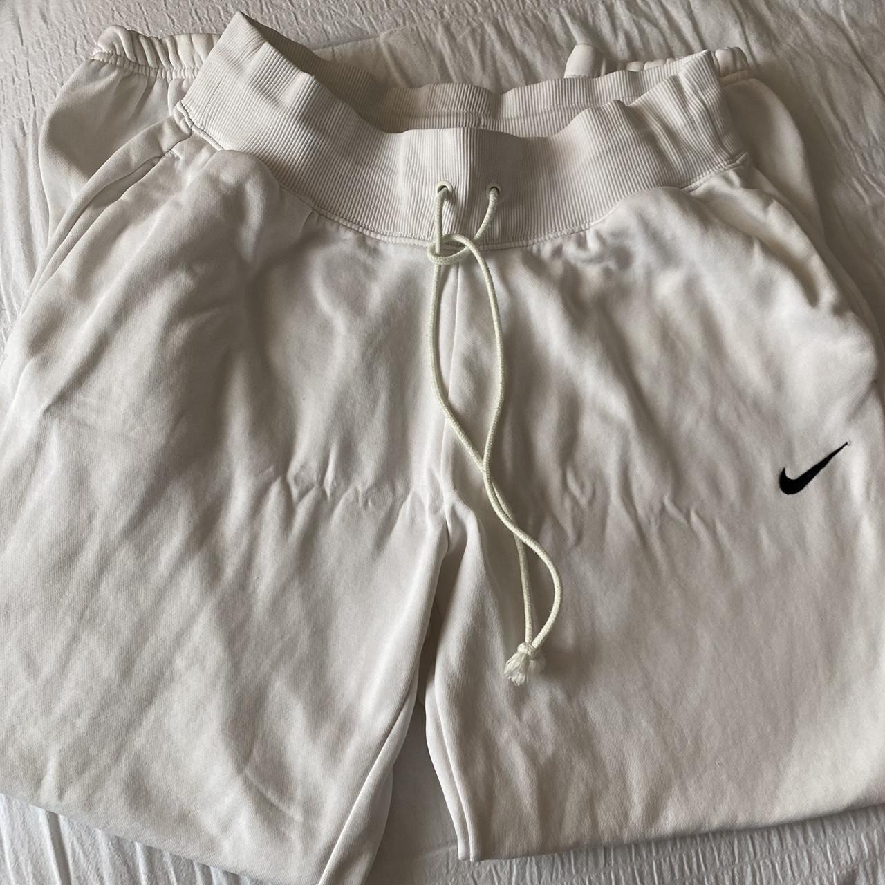 Nike sweatpants Pretty baggy fit more like a medium - Depop