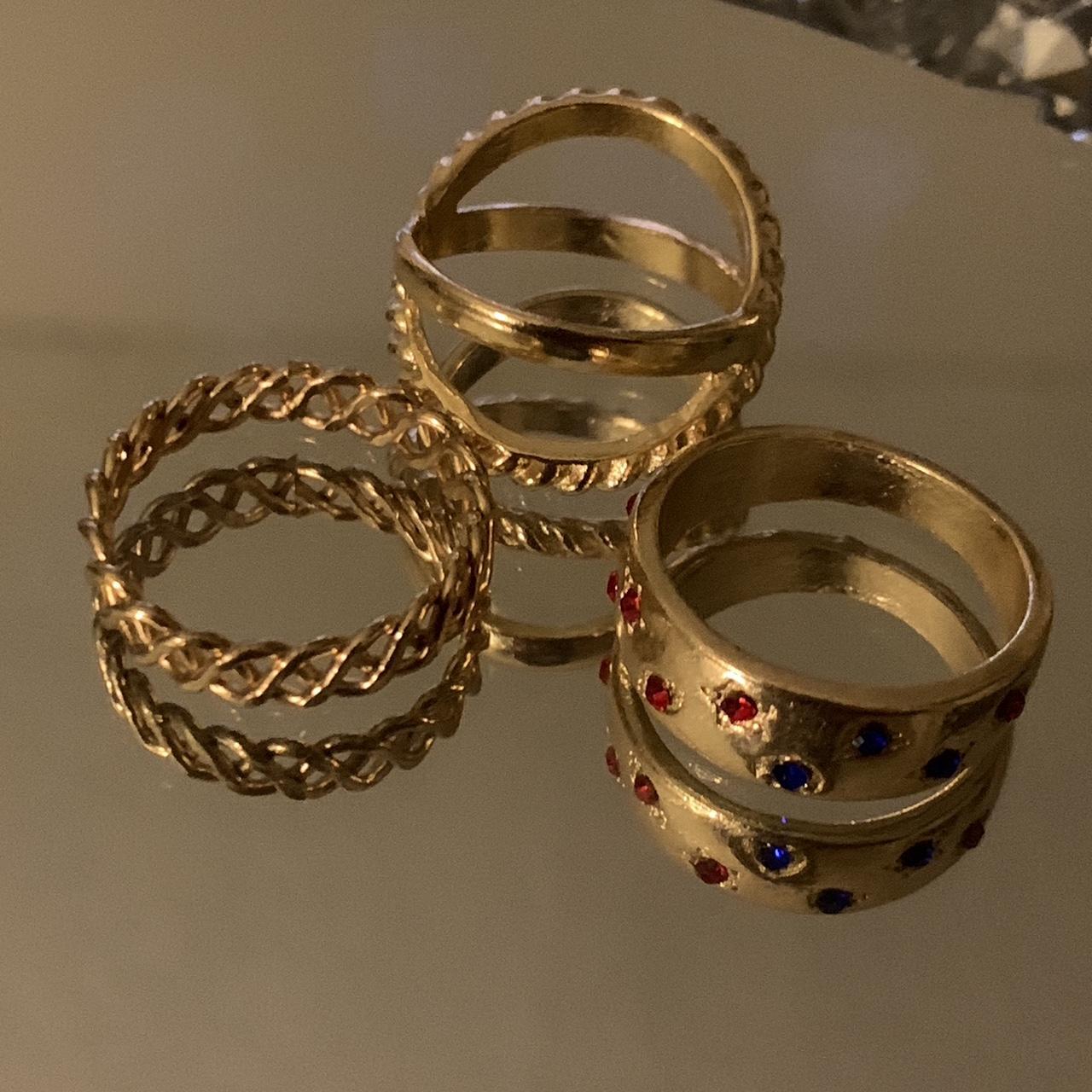 Vintage set of three rings in gold color with red... - Depop