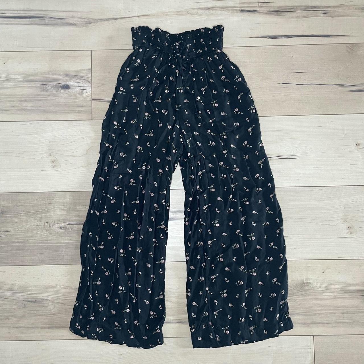 Hollister black floral cropped pants. Elastic tie Depop