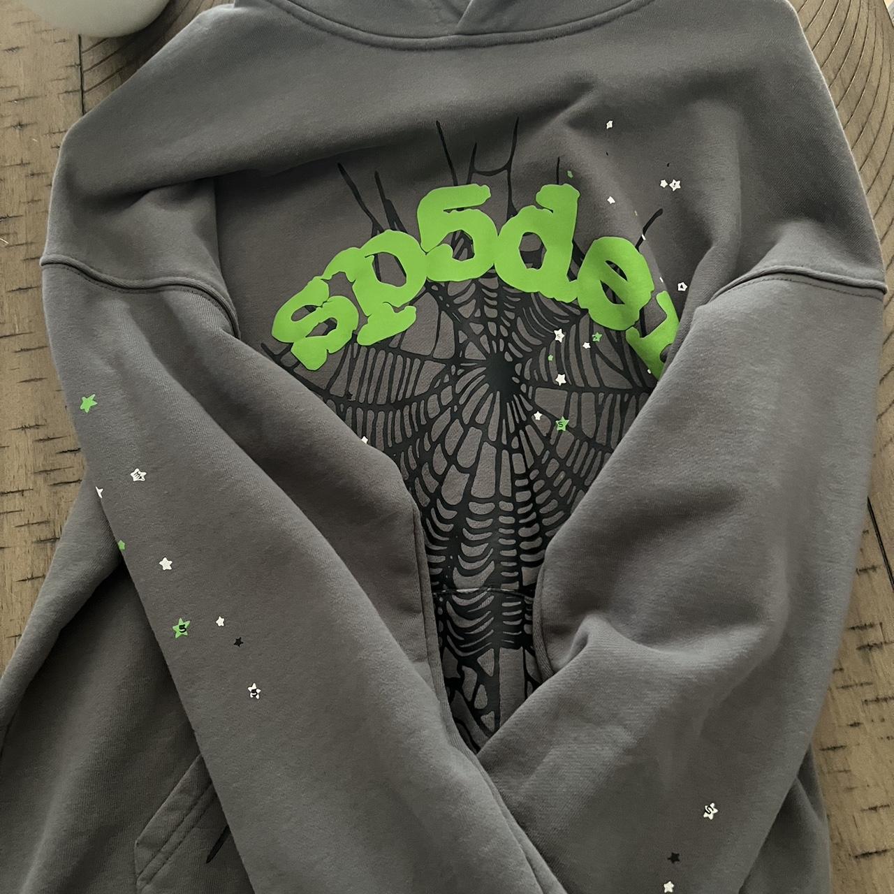 The gray and green spider hoodie is a stylish and