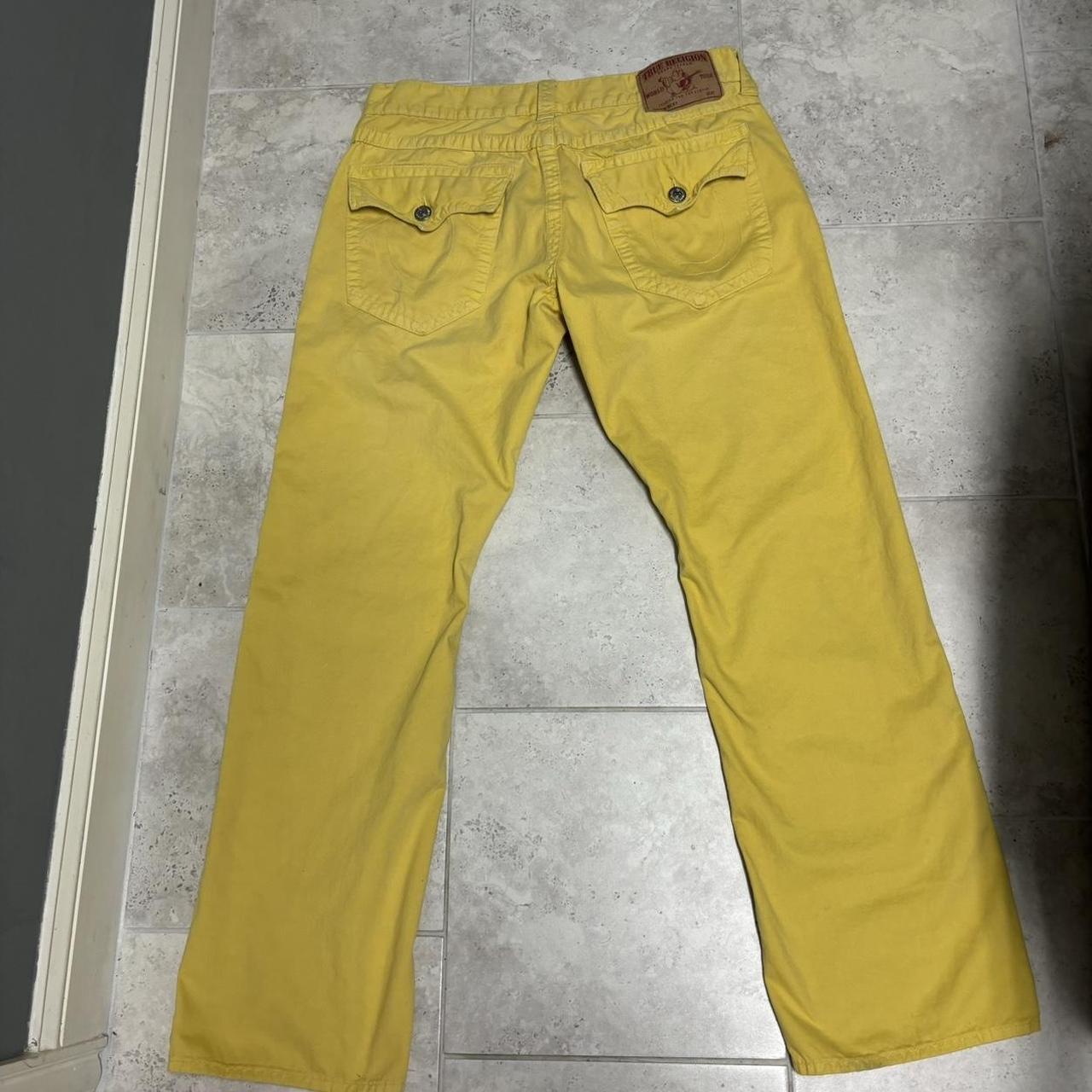 yellow true religion jeans discoloring in some... - Depop