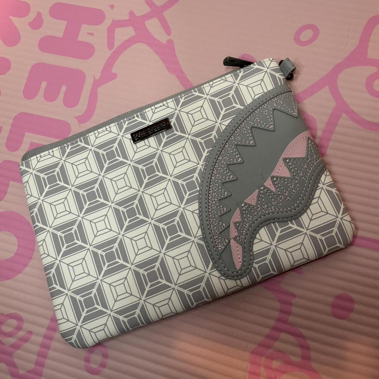 sprayground pouch🤍used once, has a little pink stain... Depop