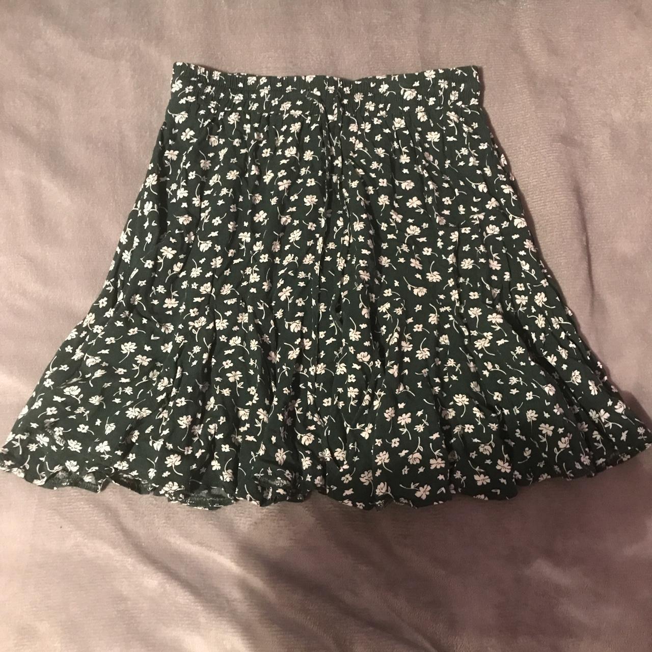 Green skirt with white flowers small amounts of