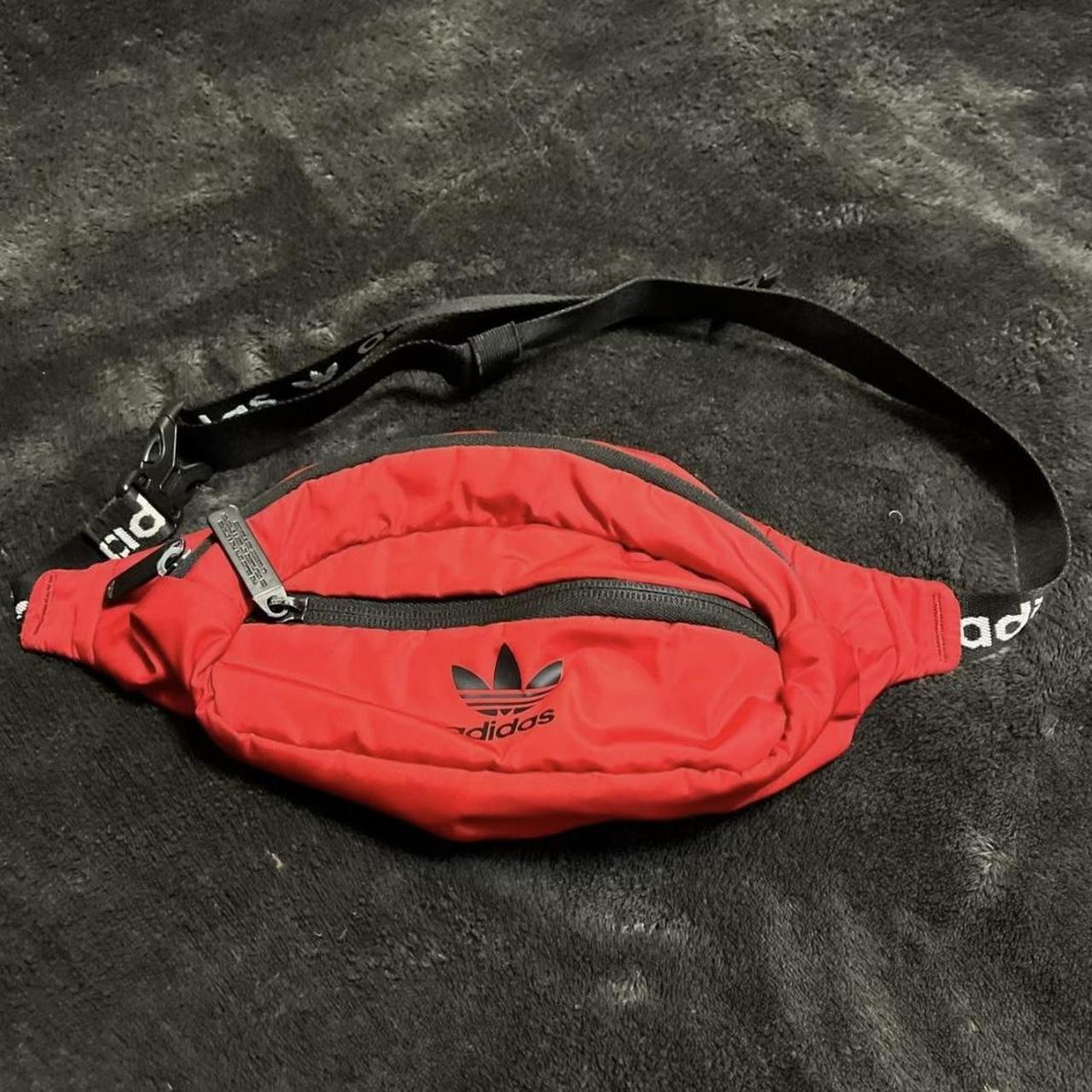 Red Adidas fanny pack w logo on strap