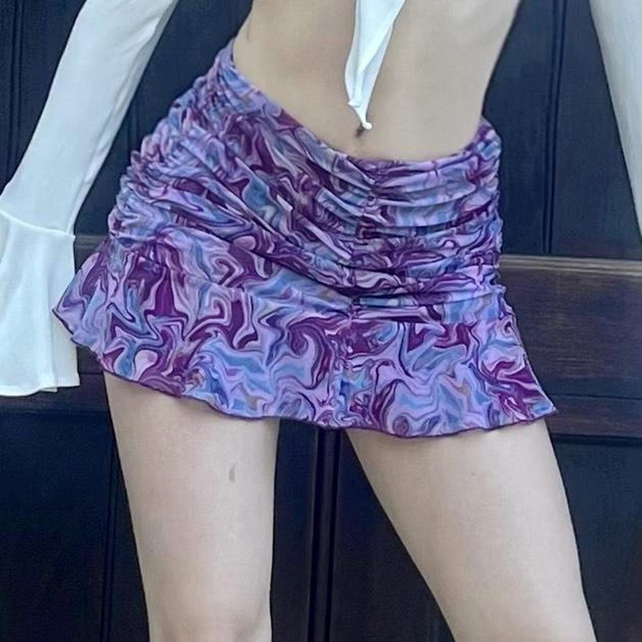 70s inspired purple mini skirt with swirl print and