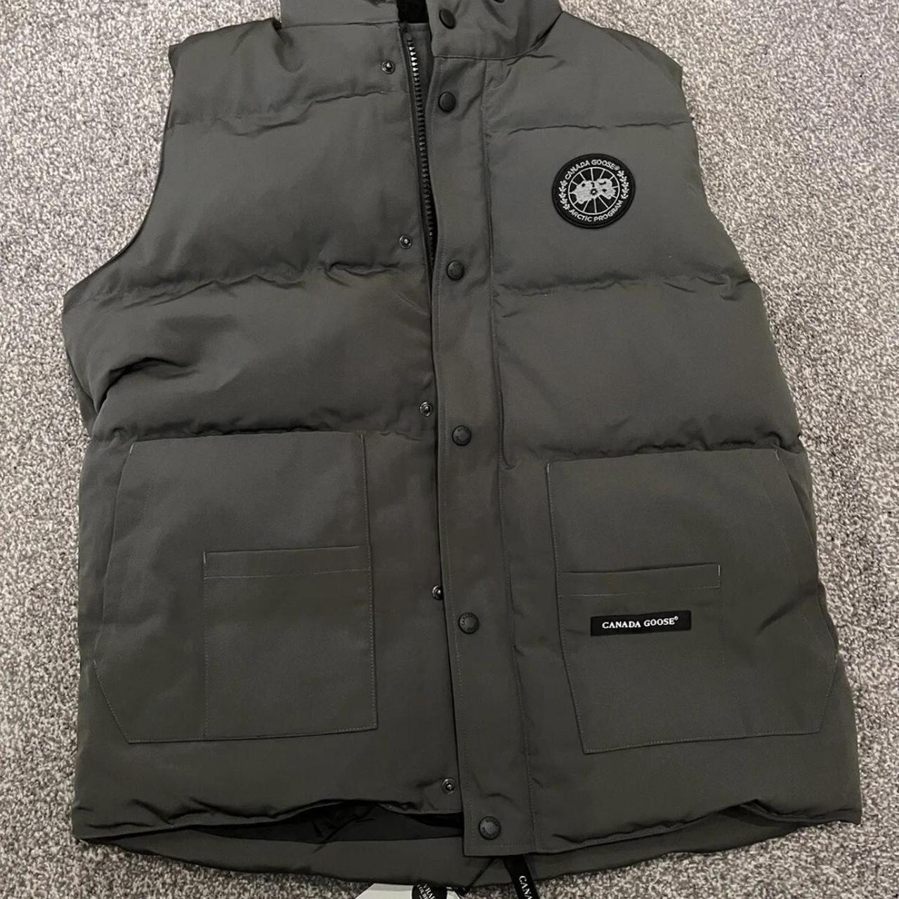 grey Canada Goose gilet with black badge. Excellent... - Depop