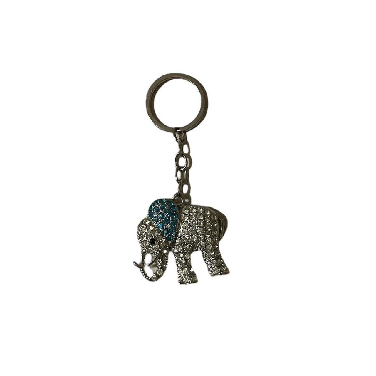 Silver and blue metal elephant keyring Message me... Depop