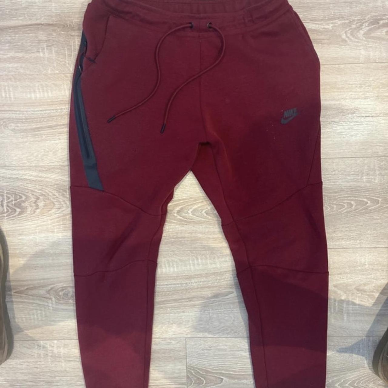 Burgundy nike tech online pants