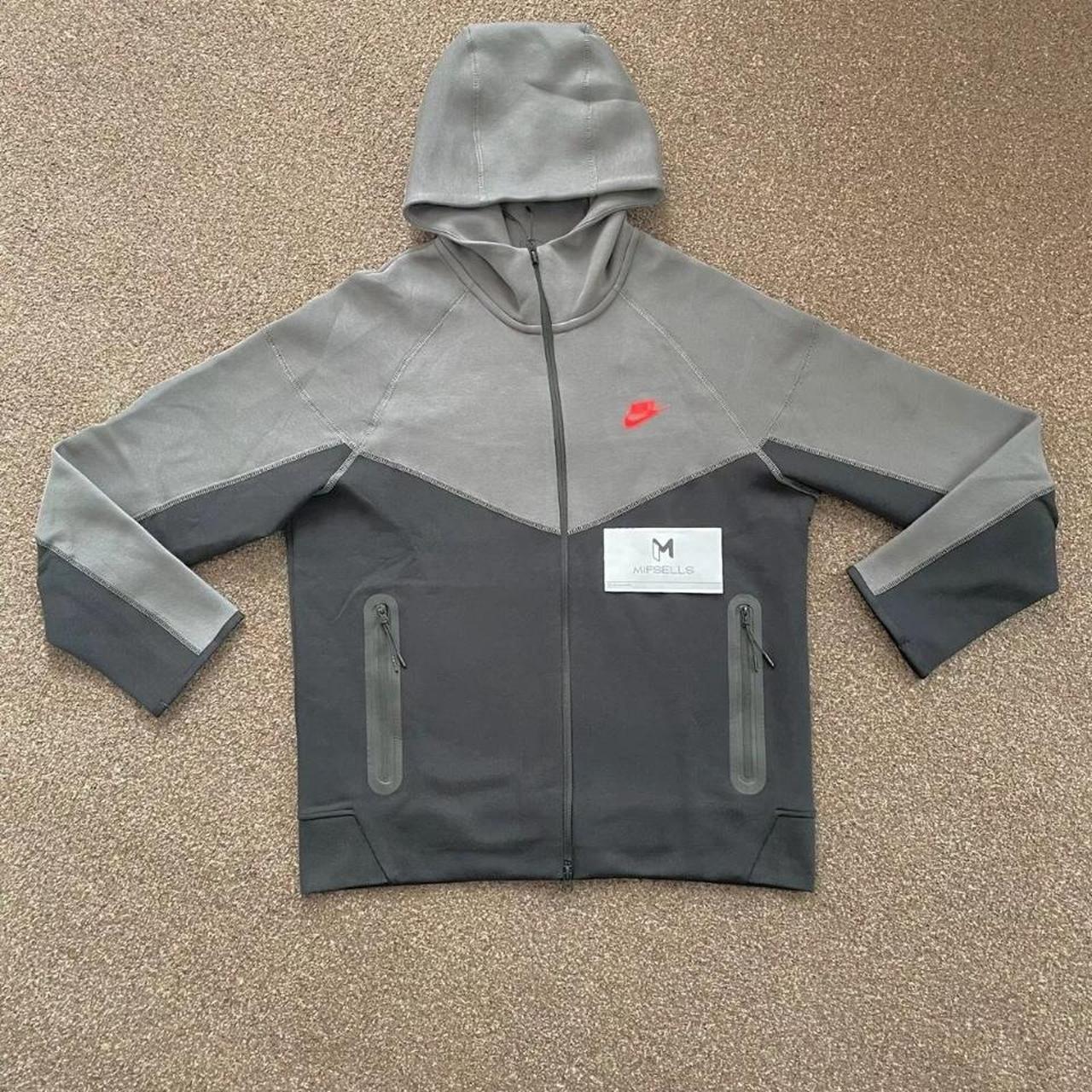 grey nike hoodie with red tick