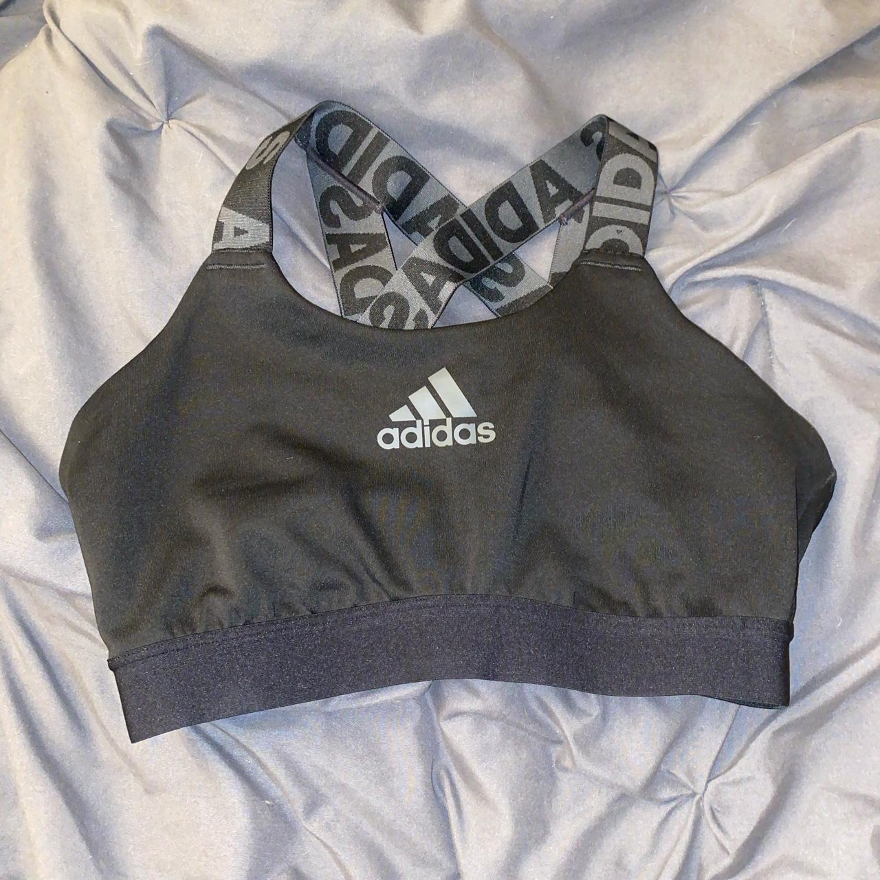 black sports bra never worn but tags cut out dm - Depop