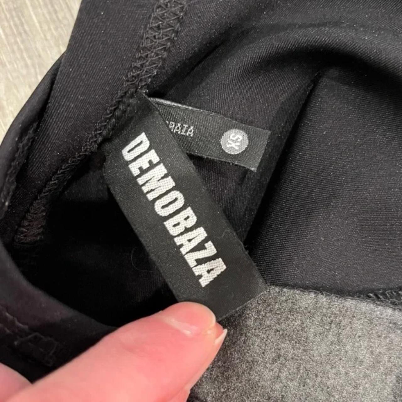 Demobaza black leggings with a thick grey stripe... - Depop