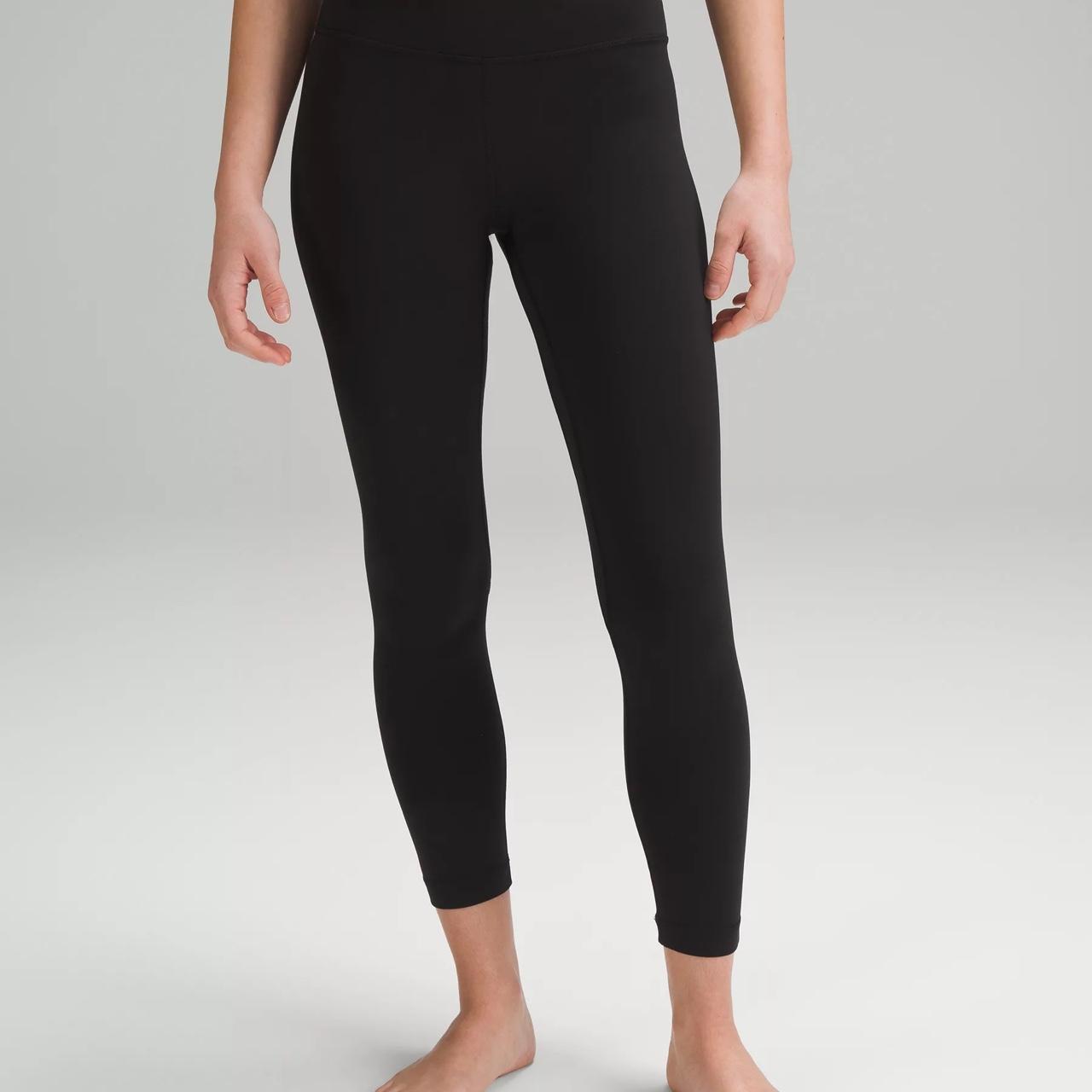 Lululemon low rise black leggings, size 4. Mild hole...