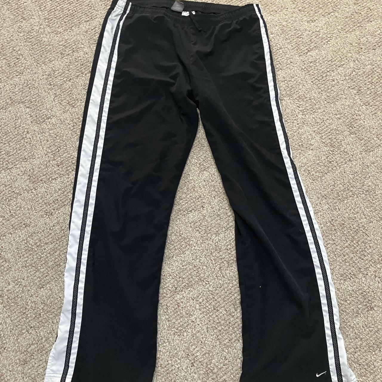 Nike large swoosh wind pants best sale