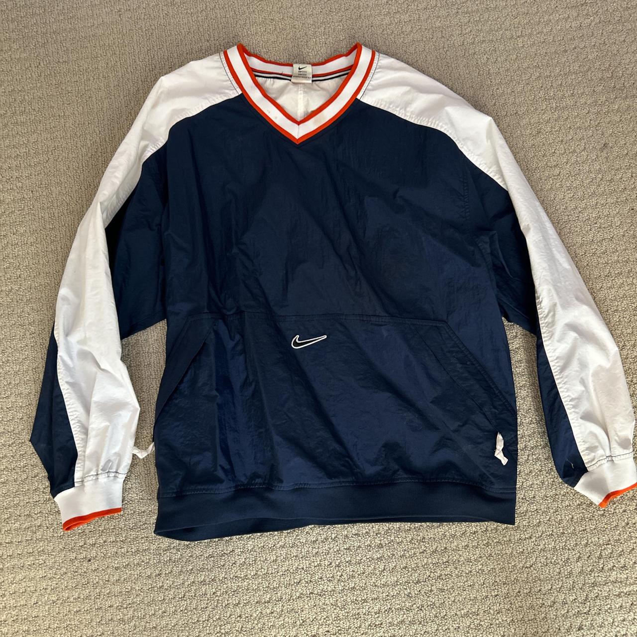 orange white and blue nike windbreaker