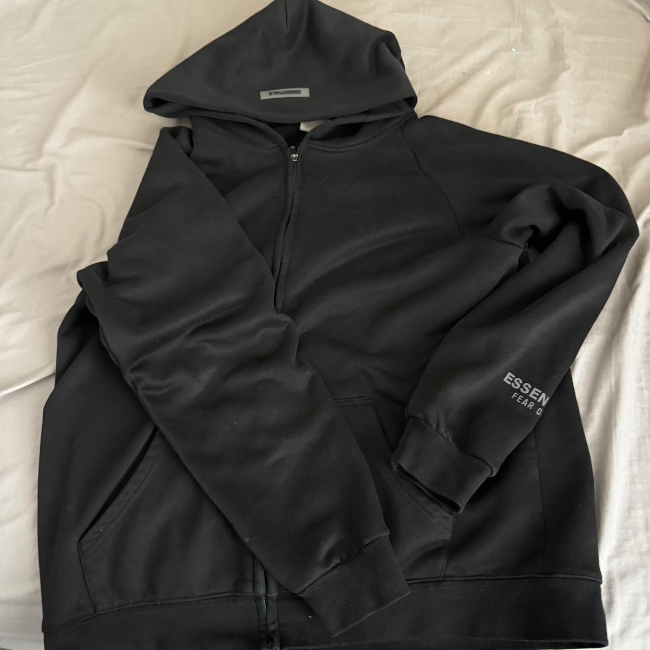 Black essentials zip up hoodie used with a stain... - Depop