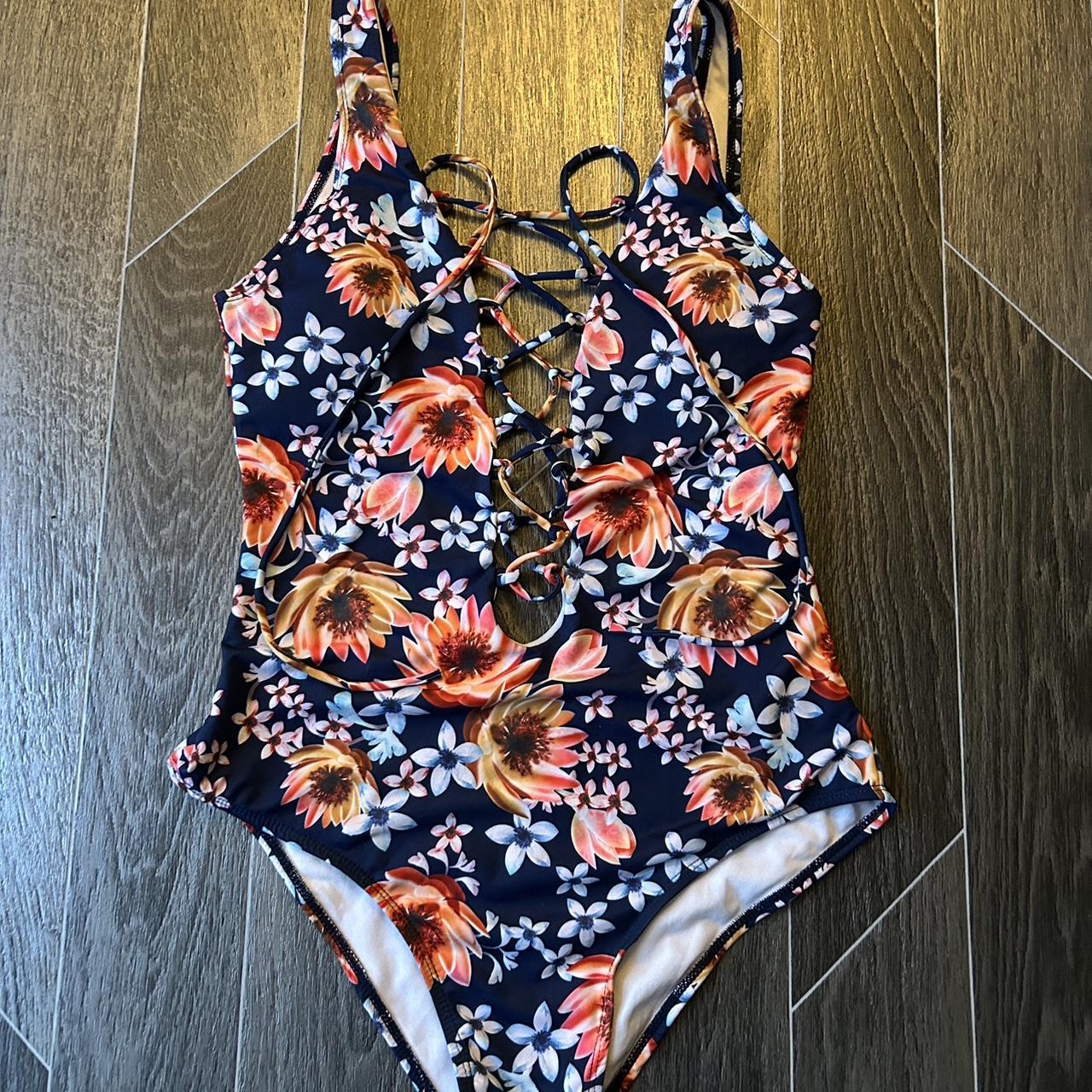 Floral one piece swimming costume with lace up front... - Depop