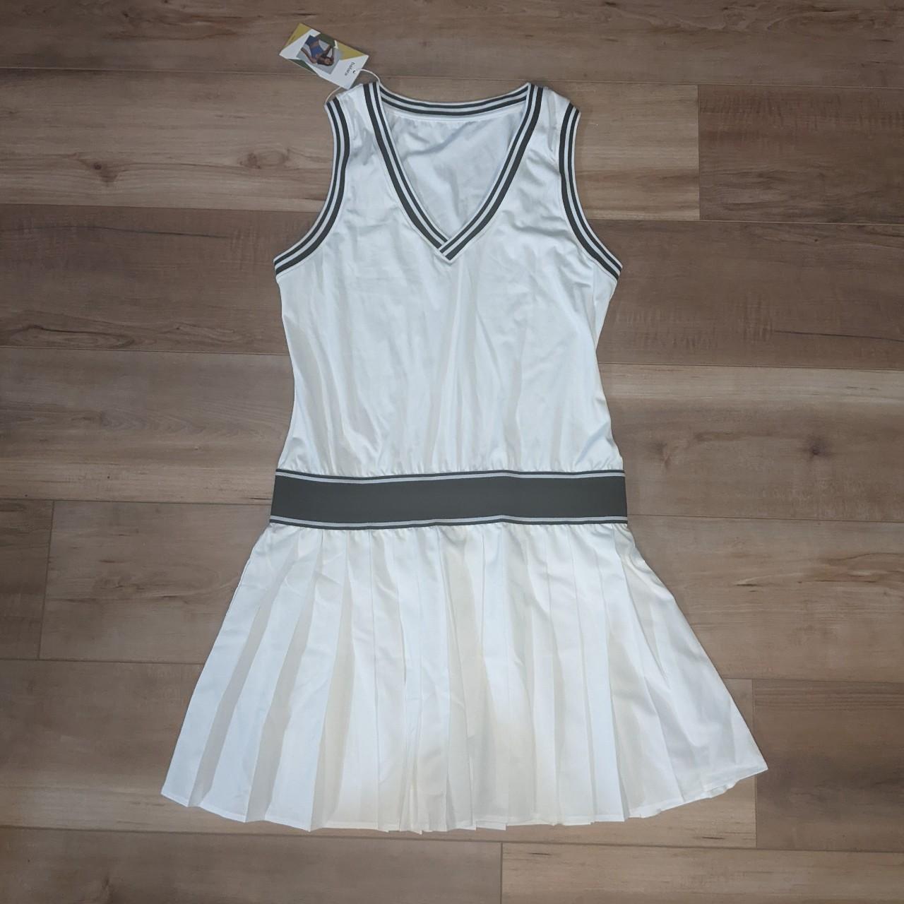 Halara tennis dress. NWT. UPF50+. White with navy... Depop