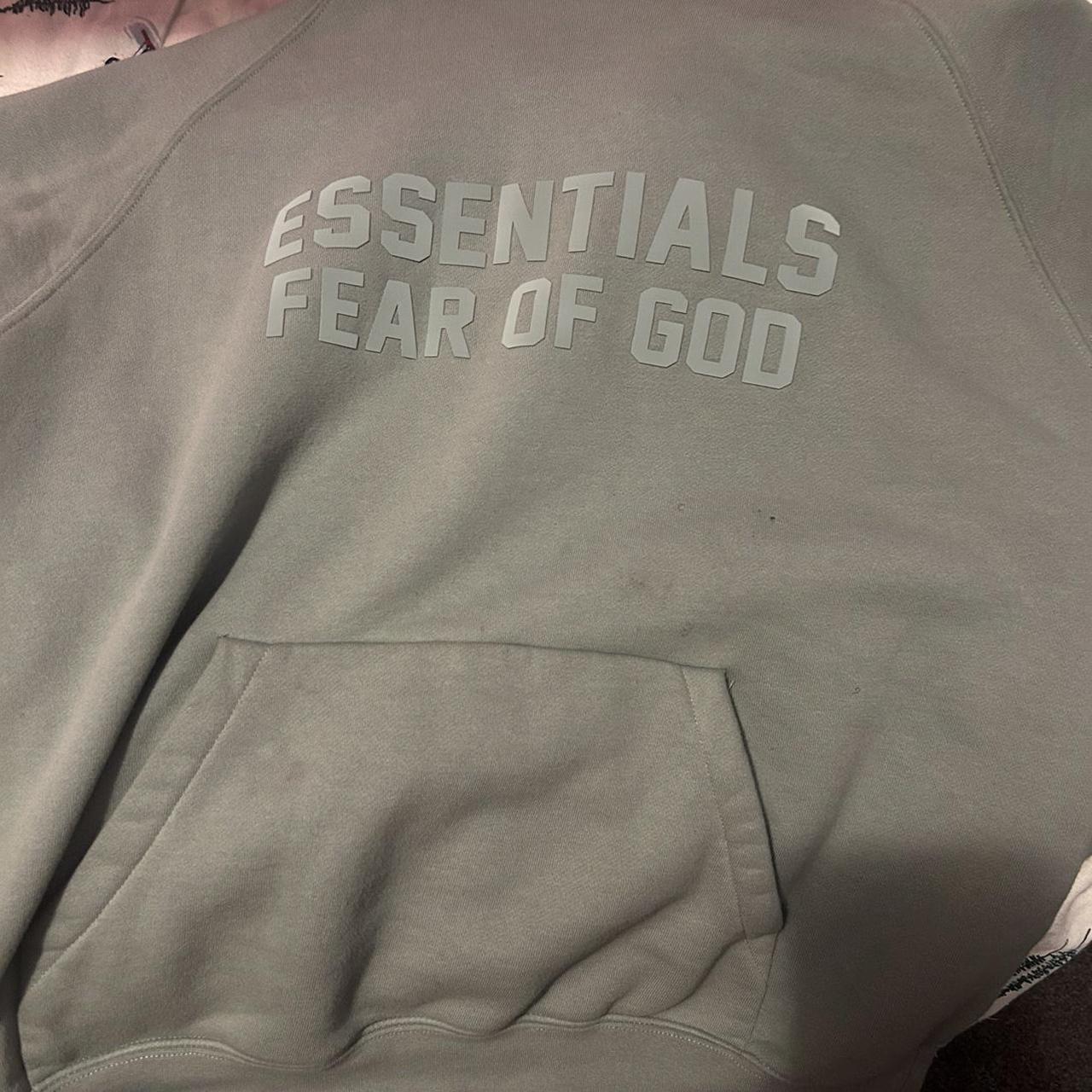 greenish blue essentials hoodie text for more... - Depop