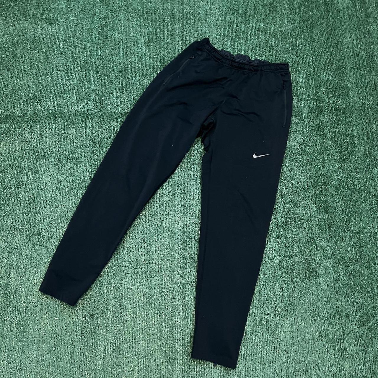 mens nike sweatpants with zipper pockets