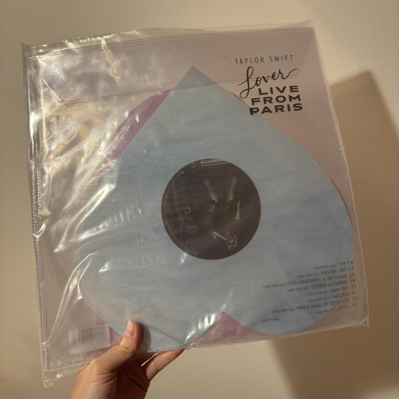 Taylor shops swift lover live from Paris vinyl in hand