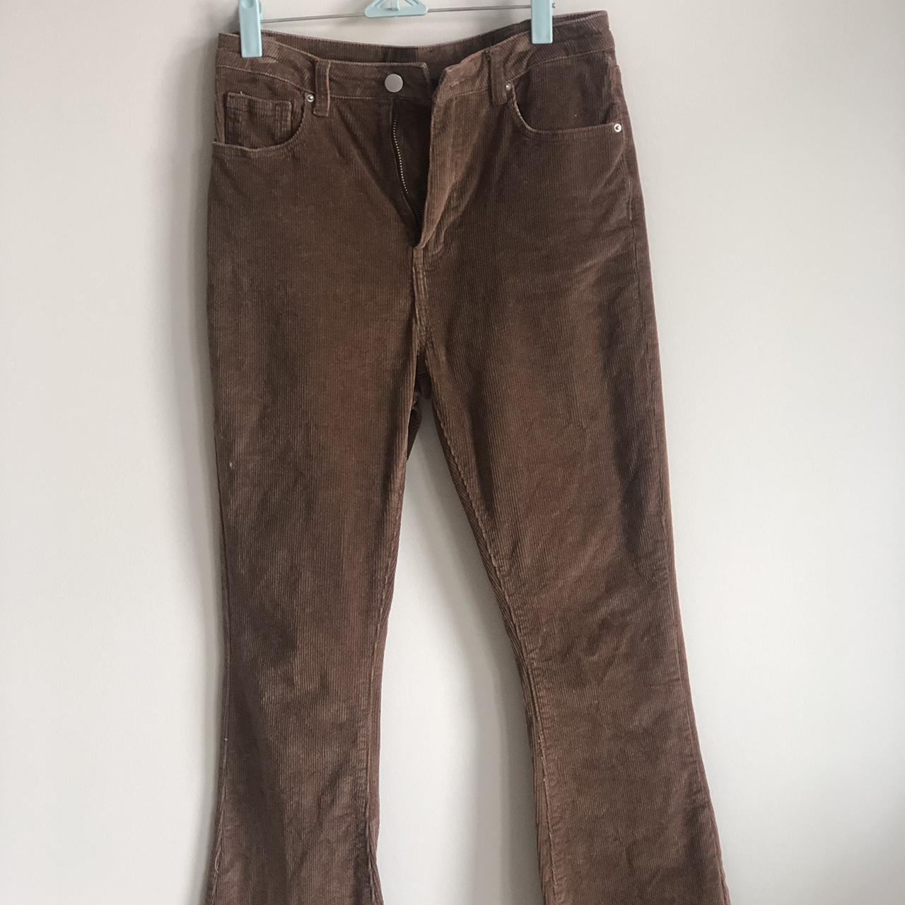 Brown corduroy bell bottom pants. Stretchy fit and... - Depop