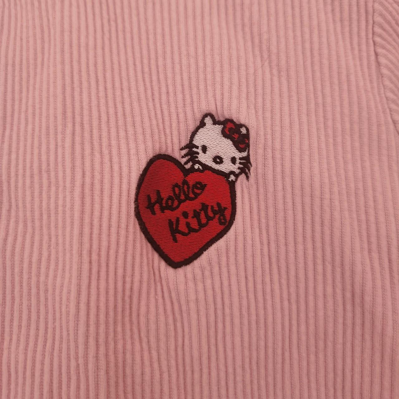 Pink Hello Kitty top, label says size L, would say... Depop