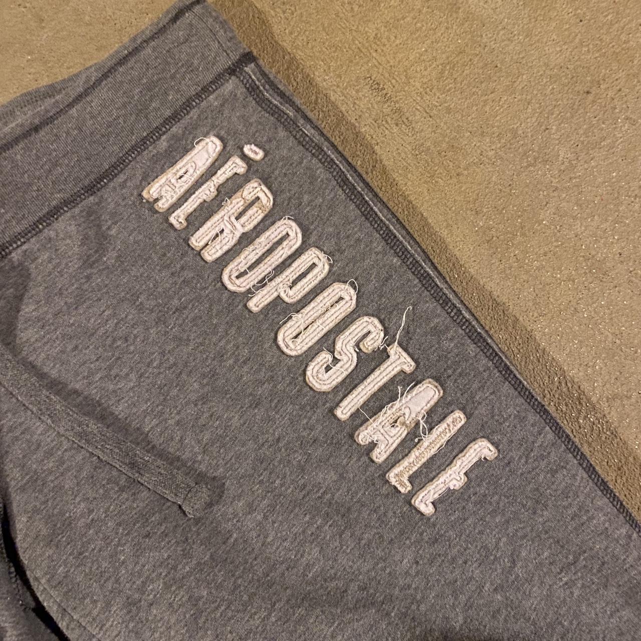 woman’s grey flared Aeropostale sweatpants