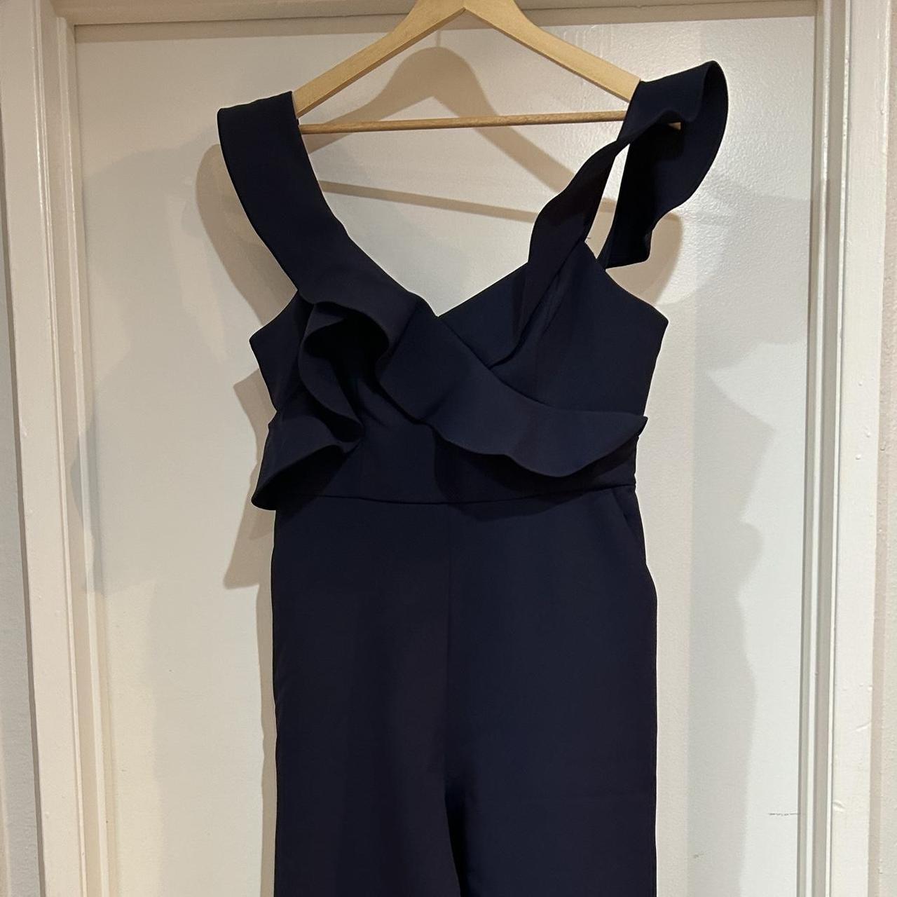 Navy blue formal jumpsuit. Ruffle straps partially