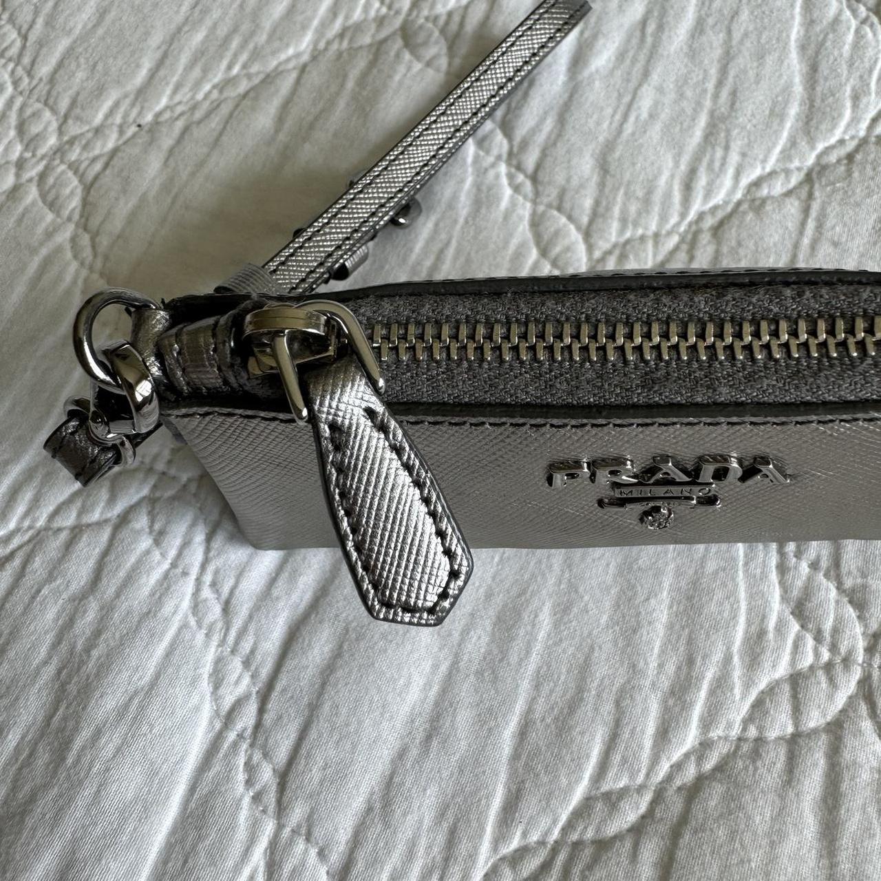 Rare Prada Saffiano silver leather wristlet wallet. Depop