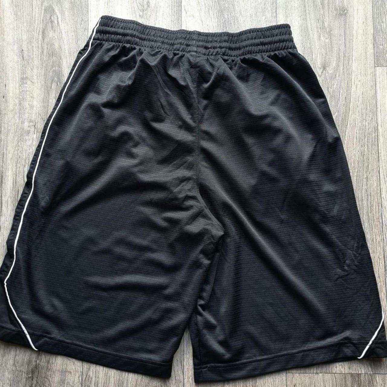 Nike black sports shorts with pockets Size... - Depop