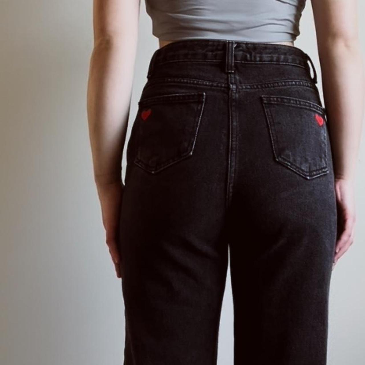 Black jeans with red decal heart (iron on) on both... - Depop