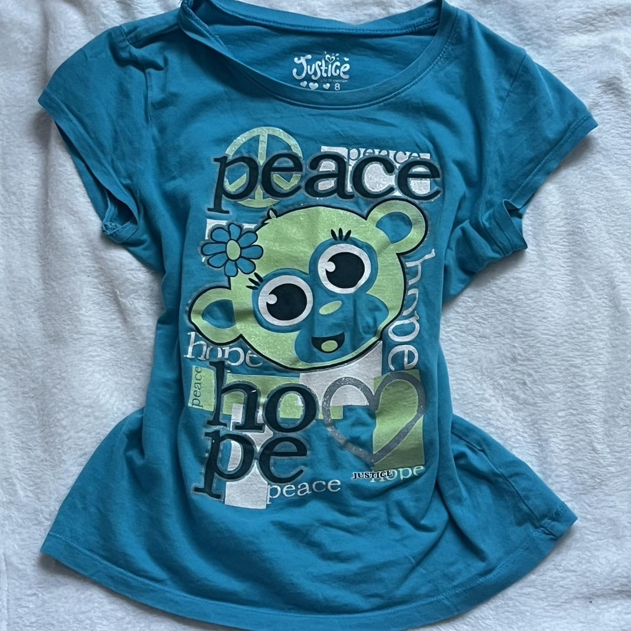 Blue and green Justice graphic baby tee with a